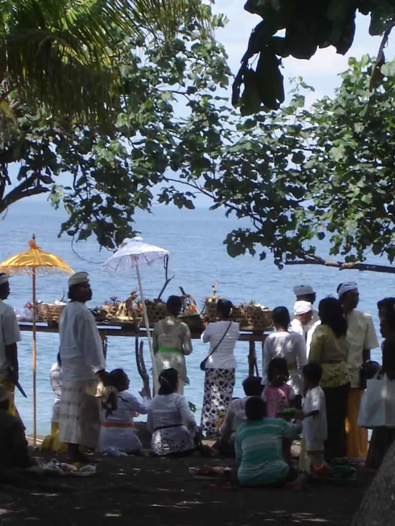 balinese religious ceremony on goa lawah beach